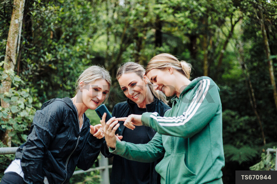 Women using Phone on Hike