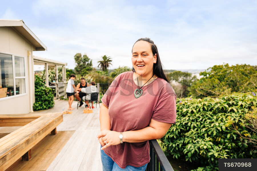 Woman leaning on deck railing