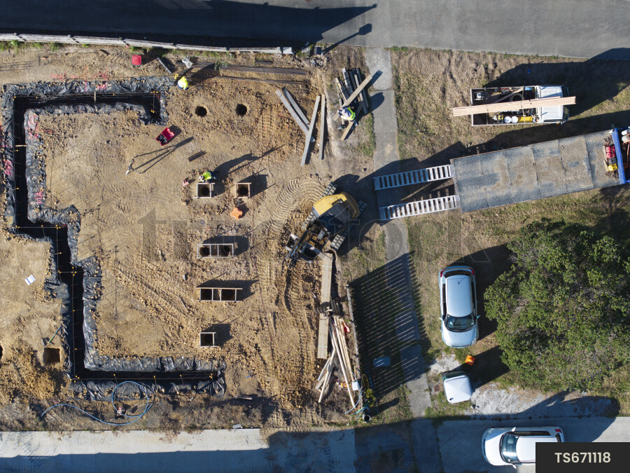 Construction site with digger and workers