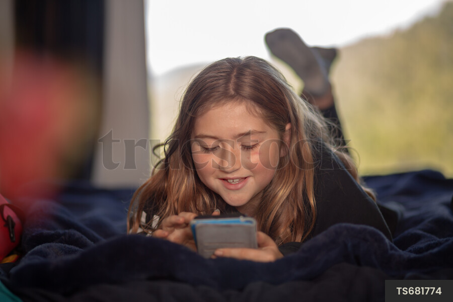 Teen Girl on Phone in Room
