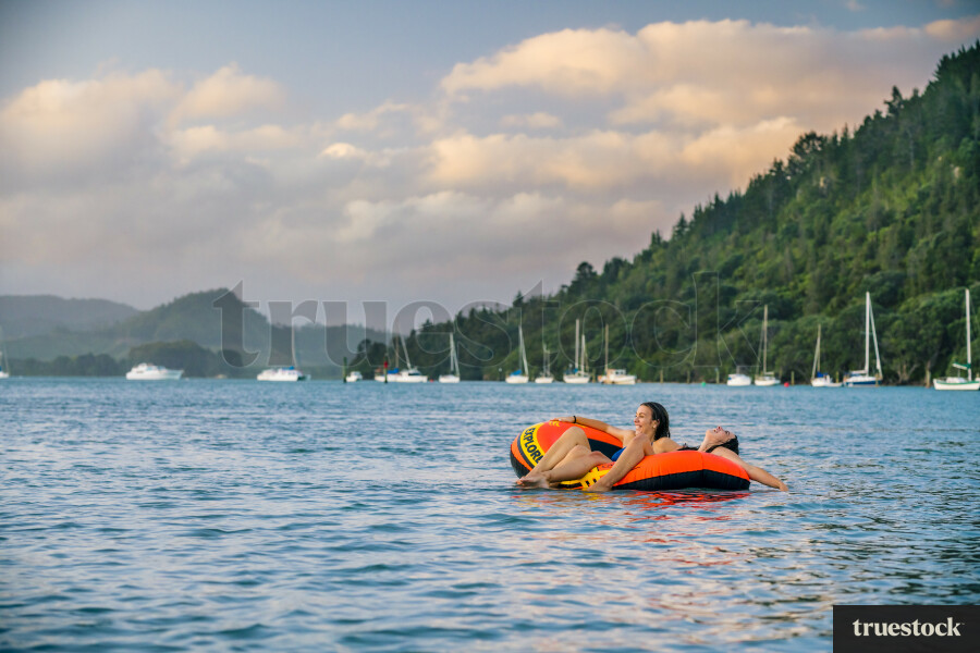 Woman Relaxing in an Inflatable Boat