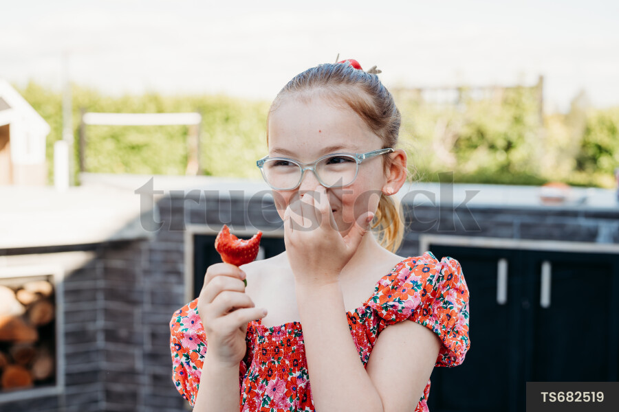 Girl Eating Strawberry