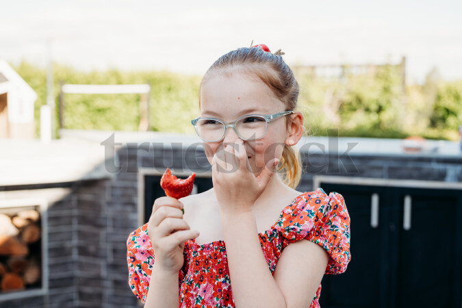 Girl Eating Strawberry