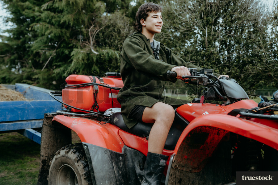 Man on farming quad bike