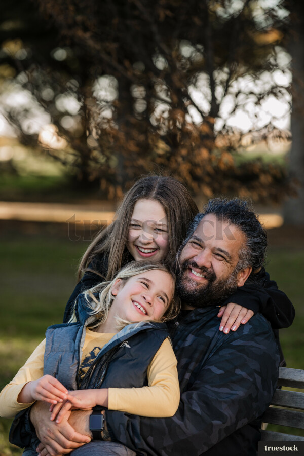 Dad with his Daughters at the Park