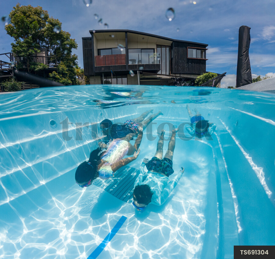Kids Swimming in Pool