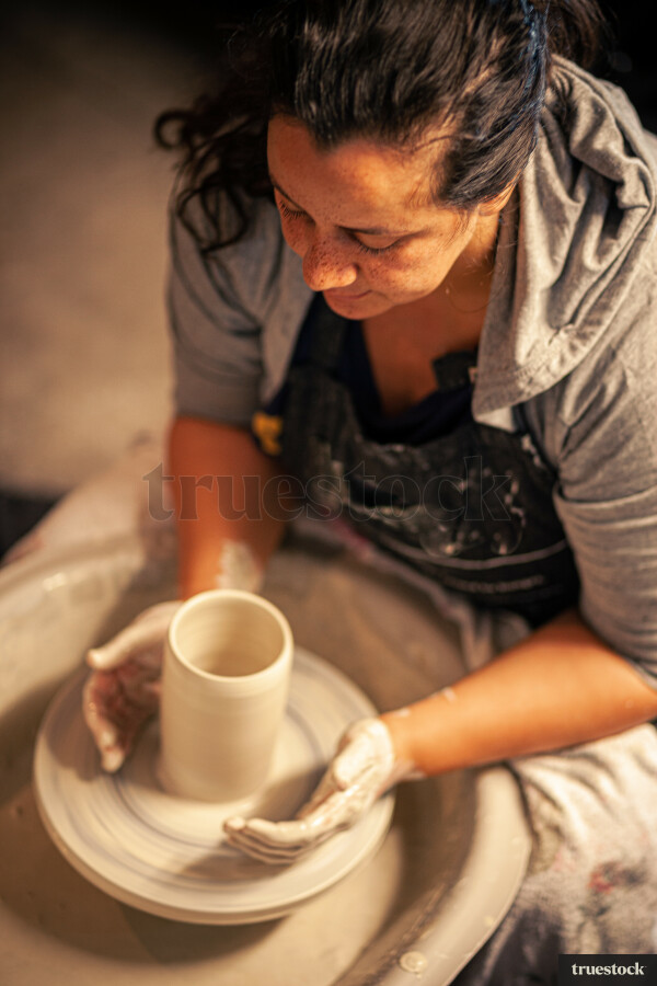 Woman making pottery