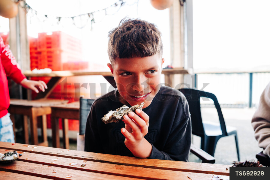 Boy holding paua