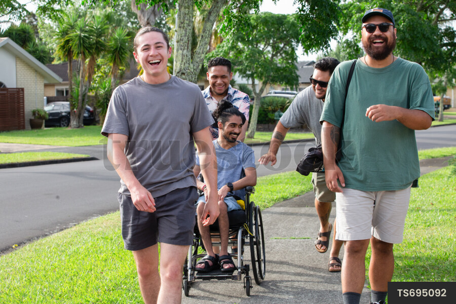 Friends walking on footpath