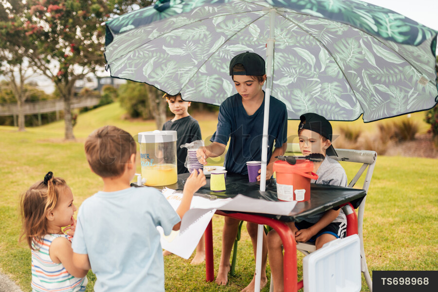 Kids Buying Lemonade at Lemonade Stand