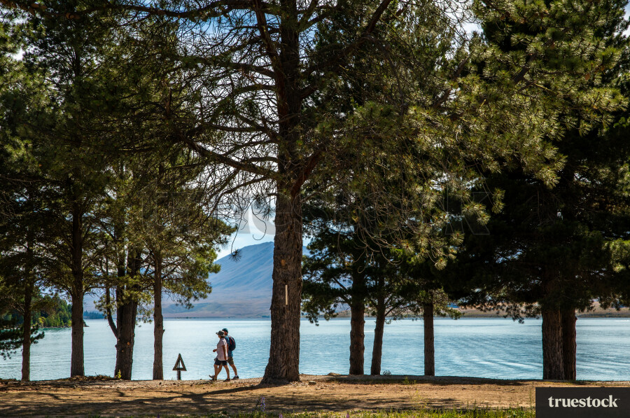 People walking by Lake Tekapo