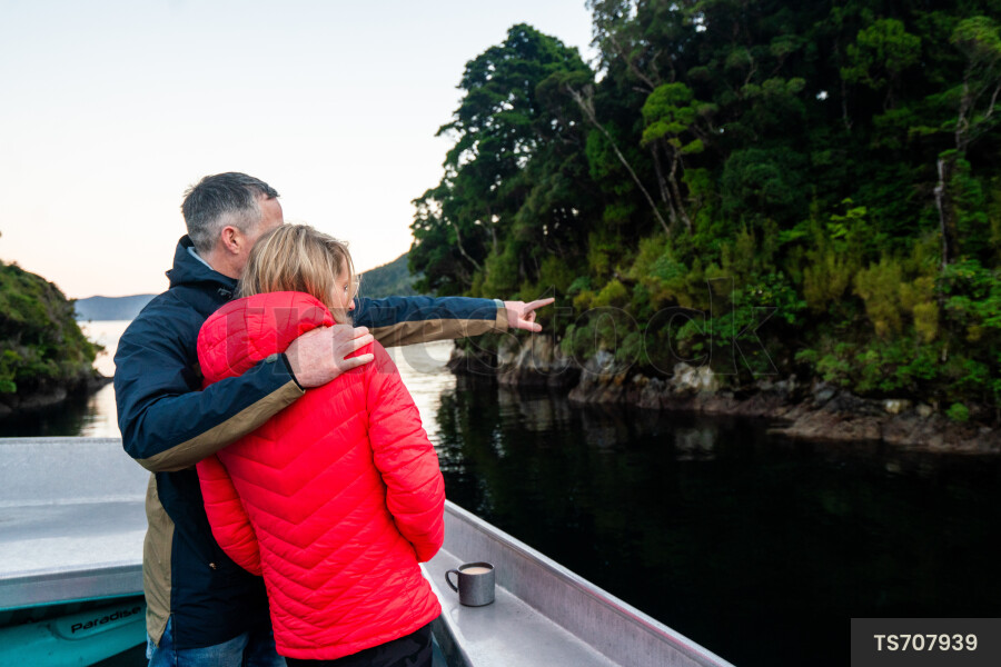 Couple on boat at sunset