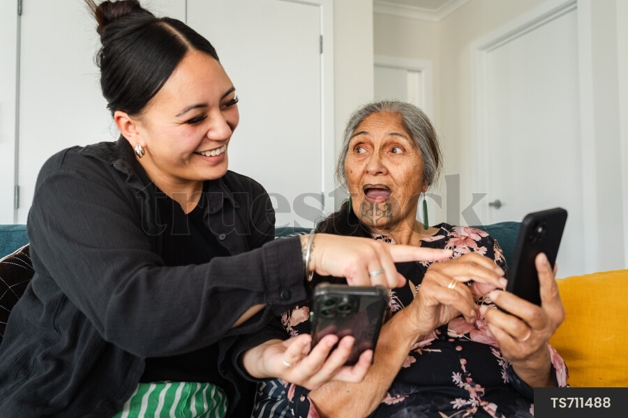 Granddaughter Teaching Nana How to Use Phone