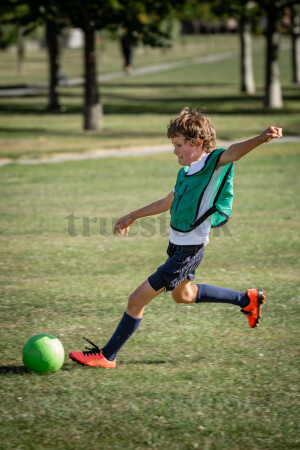 Boy playing soccer