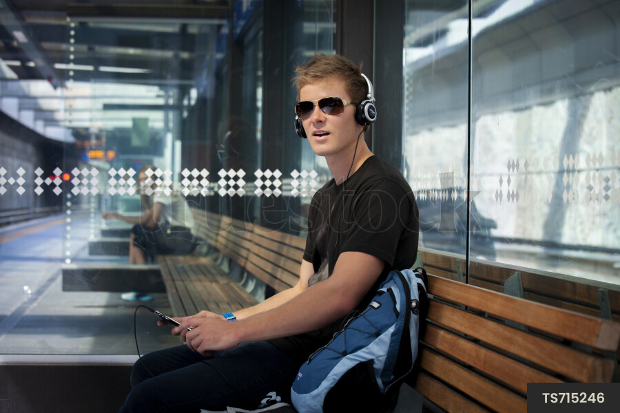 Man Sitting at Train Station
