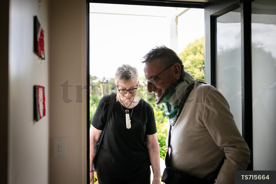 Health carer and patient at front door