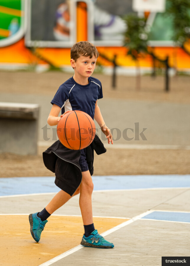 Boy playing basketball