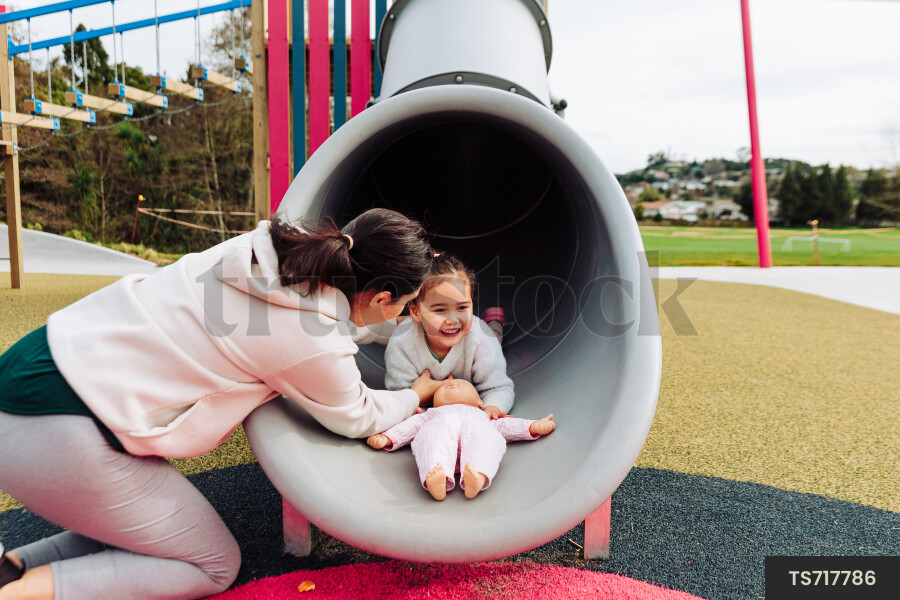 Young Girl on Slide at Park