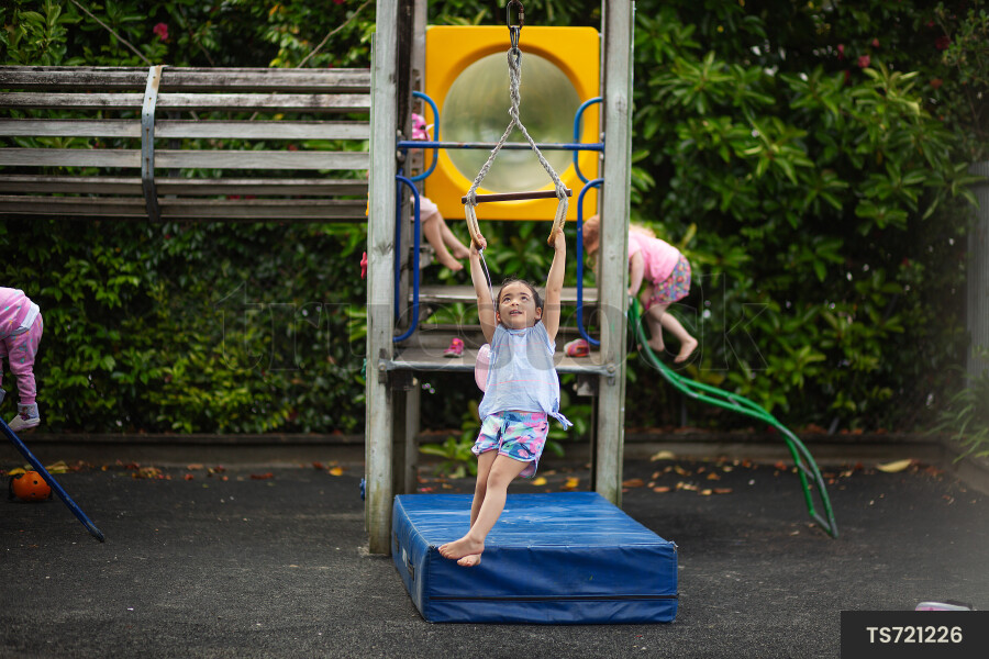 Girl playing on kindergarten playground