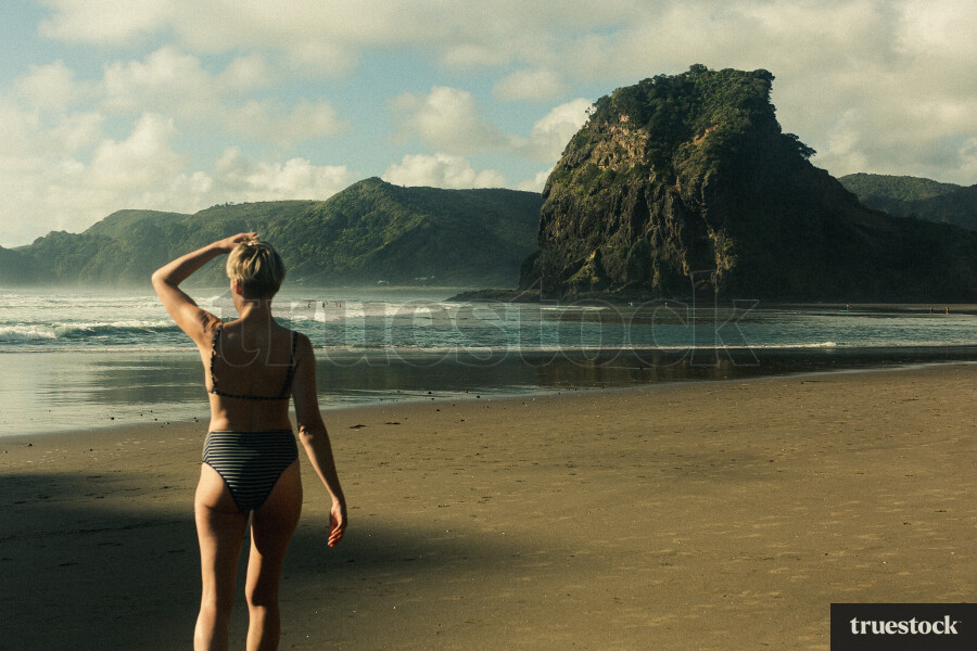 Woman Swimming at Piha Beach