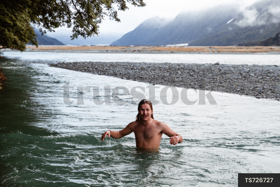 Man swimming in river