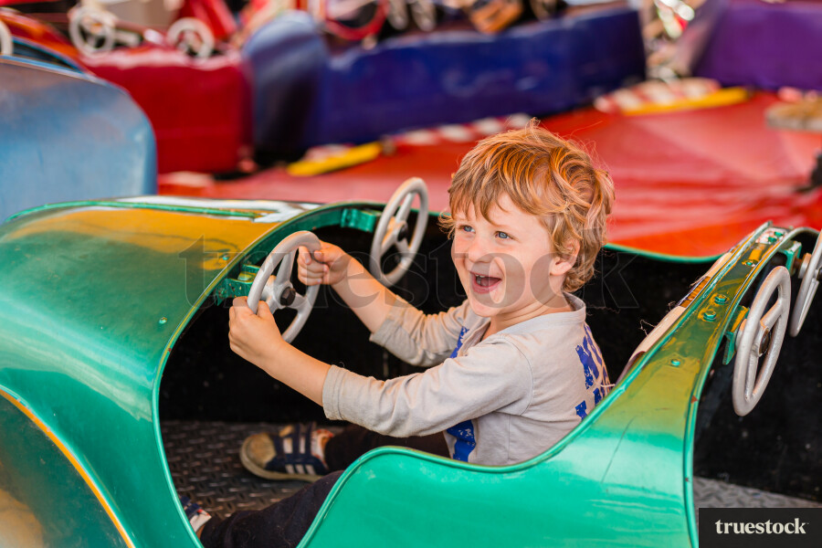 Toddler in a toy car