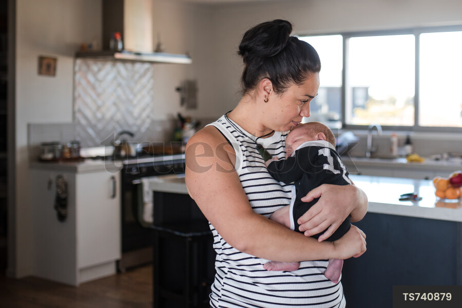 Woman holding her baby daughter