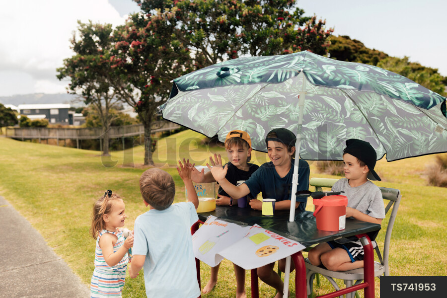 Kids Buying Lemonade at Lemonade Stand