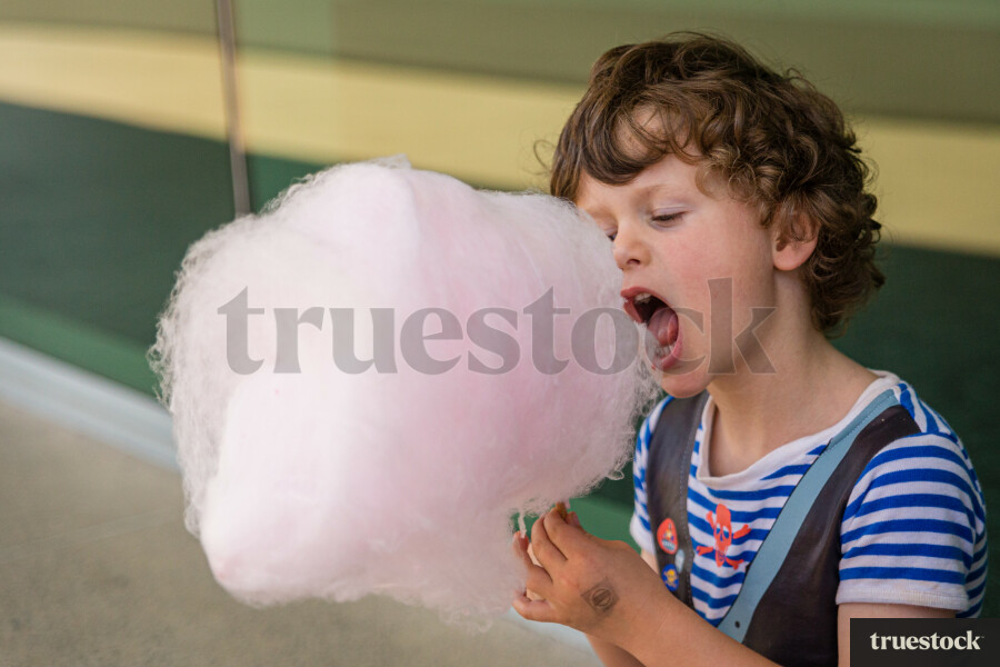 Boy eating candy floss