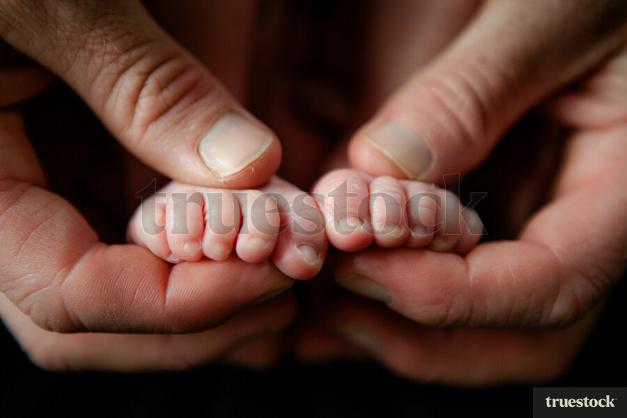 Baby feet in Father hands