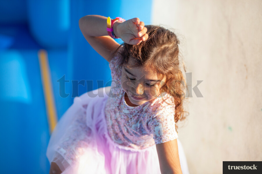 Child climbing and bouncing in the inflatable bouncy castle