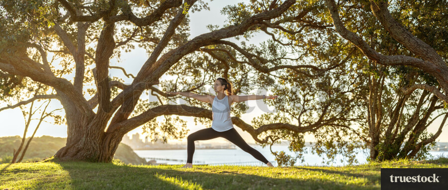 Woman doing yoga at the park