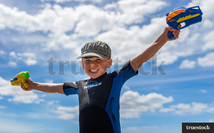 Child playing with water guns