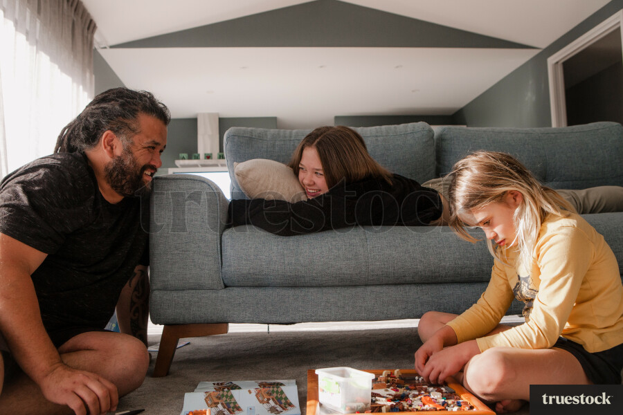 Father Playing in the Lounge with his Daughters