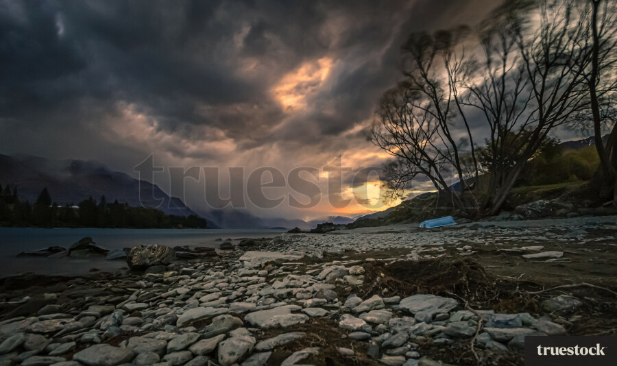 Snow storm coming over the lake at sunset