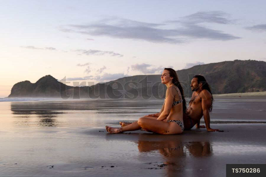 Couple sitting on beach