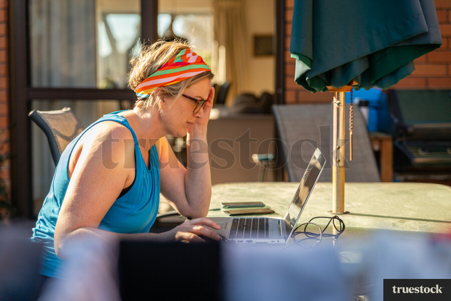 Adult working from home in the backyard