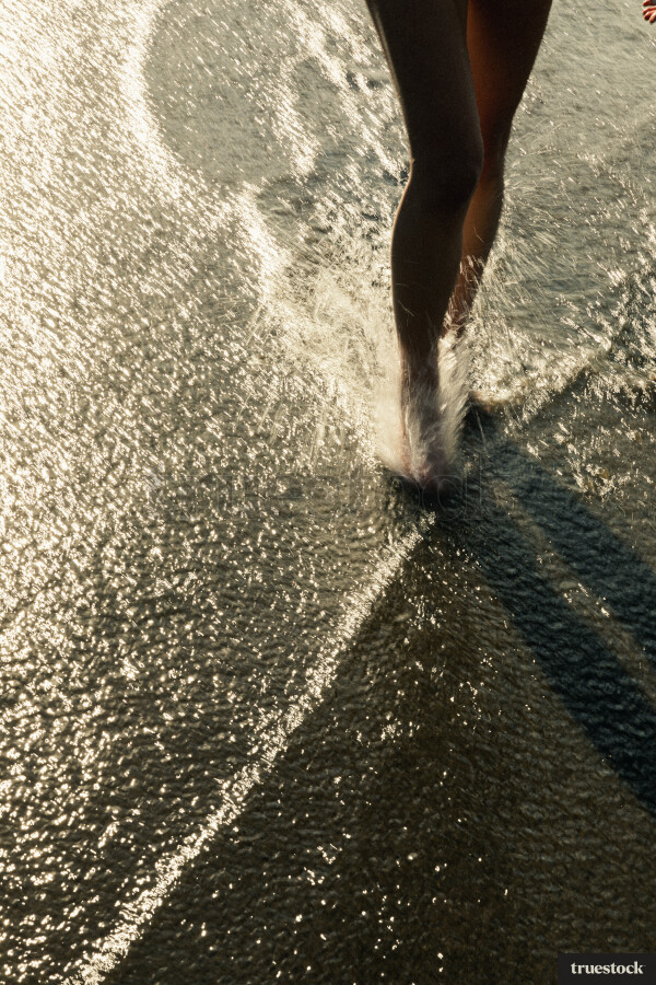 Woman Swimming at Piha Beach