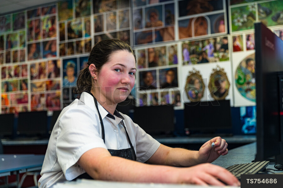 Girl Using Computer in Art Class