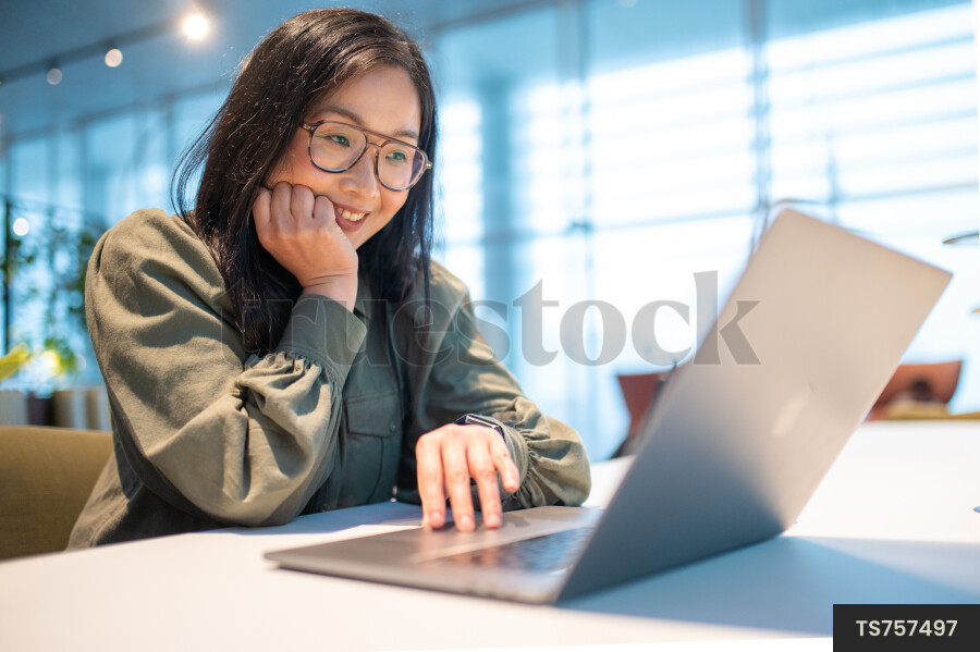 Woman Using Laptop for Work