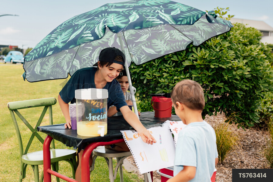 Kids Buying Lemonade at Lemonade Stand