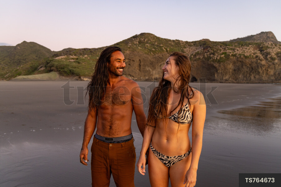 Couple on beach at sunset