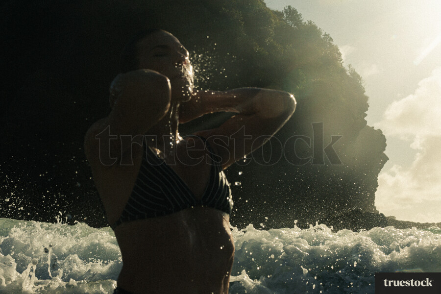 Woman Swimming at Piha Beach