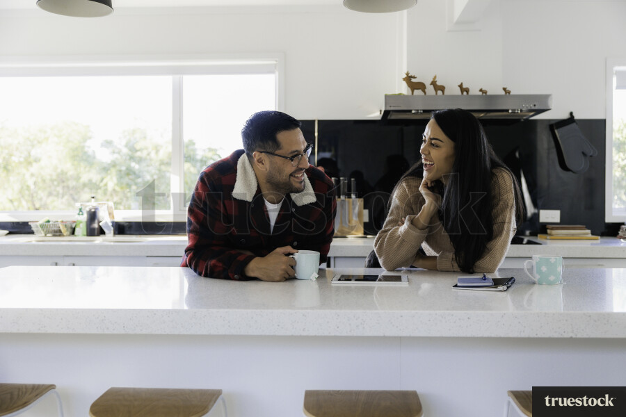 Parents Chat in Kitchen