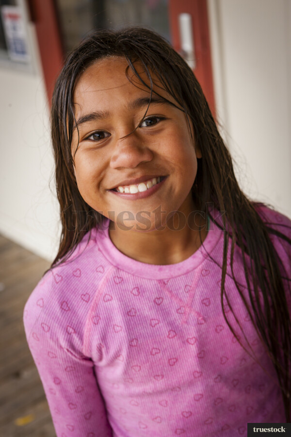 Young Girl Wet from Playing in Water