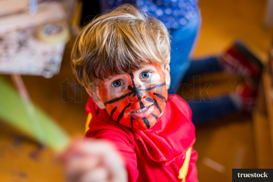 Toddler with face painted
