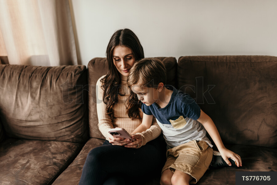 Mother and Son Using Phone