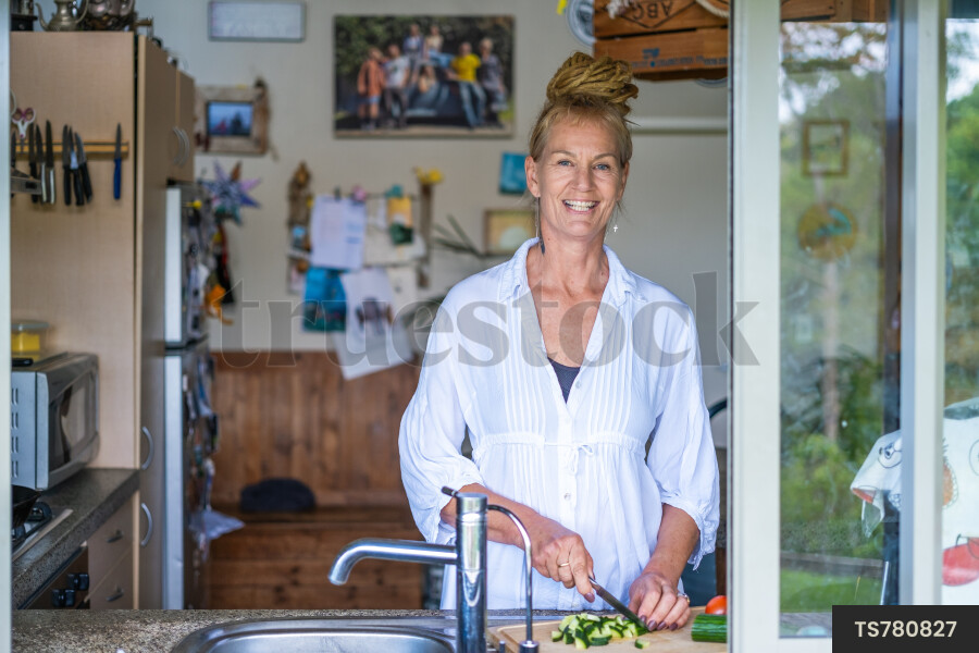 Woman in Kitchen Window