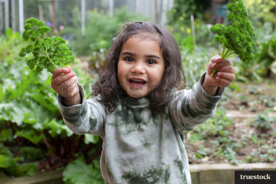 Young Girl in Greenhouse
