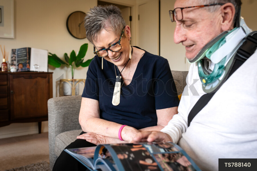 Health carer and patient with photo album